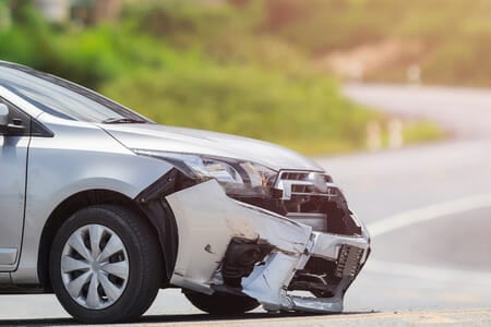 Car with wrecked bumper