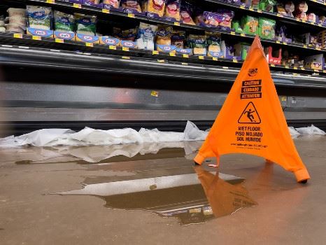 puddle of water on grocery store floor